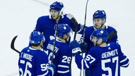 Toronto Maple Leafs players celebrate after Eric Fehr (23) scored during pre-season action. The Leafs are feeling confident that they can build off last season's unexpected success. maple-leafs