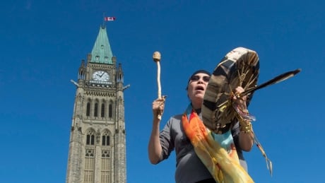 Chief Marcia Brown Martel sings outside the parliament buildings following a government news conference announcing a compensation package for indigenous victims of the Sixties Scoop, in Ottawa last year. 60s Scoop Deal 20171006 TOPIX