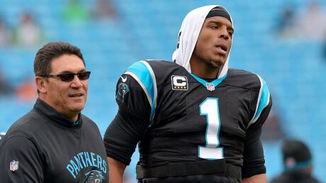Head coach Ron Rivera, left, said quarterback Cam Newton's apology for his sexist remarks to a female reporter "needed to be said." newton-cam-rivera-ron-100617