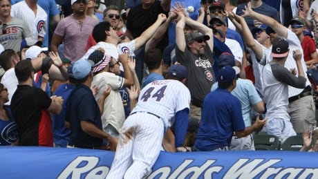 Anthony Rizzo of the Chicago Cubs tries to catch a foul ball, in this file photo from July. Cubs-foulBall-04062017