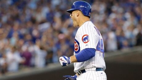 Chicago Cubs' Anthony Rizzo reacts after hitting an RBI single during the eighth inning of Game 3. nationals-cubs