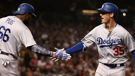Cody Bellinger, right, hit his first career post-season home run and drove in two runs as the Los Angeles Dodgers defeated the Arizona Diamondbacks 3-1 to advance to the NLCS. cody-bellinger