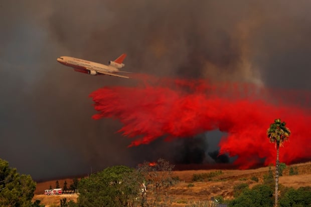 CALIFORNIA FIRE DC-10 aircraft drops fire retardant on wildfire