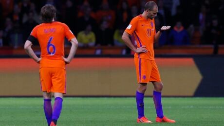 Netherland's Bas Dost, right, and his teammate Georginio Wijnaldum contemplate their failure to qualify for next year's World Cup despite a 2-0 win over Sweden on Tuesday. netherlands-sweden