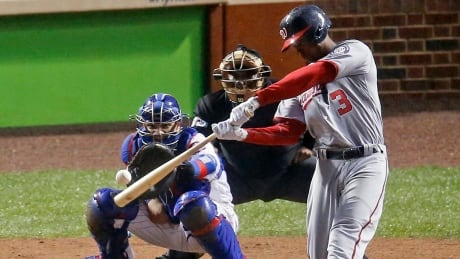 Washington Nationals' Michael Taylor (3) hits a grand slam against the Chicago Cubs during the eighth inning of Game 4 on Wednesday. nationals-cubs