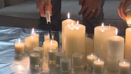 A small crowd gathered at the Derksen home Wednesday night to light a candle and talk.
Candles at Derksen home