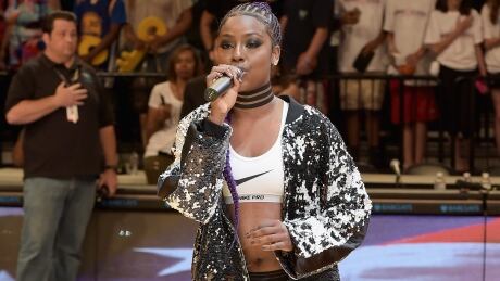 Singer Justine Skye, shown performing at a basketball tournament in July, knelt in protest after singing the American national anthem prior to the Brooklyn Nets' season opener on Friday. 651121563SV00024_Roc_Nation