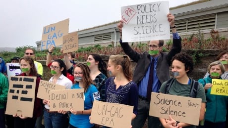 Protesters gather outside a meeting where a climate change report was to be released, Monday, Oct. 23, 2017, in Providence, R.I. The Environmental Protection Agency kept three of its scientists, who had been expected to discuss the report on the health of Narragansett Bay, from speaking at the event. Climate Change EPA