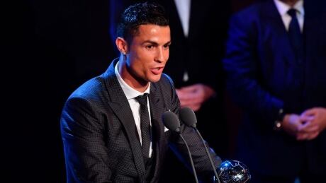 Real Madrid and Portugal forward Cristiano Ronaldo accepts his FIFA player-of-the-year award at a ceremony on Monday.
ronaldo-cristiano