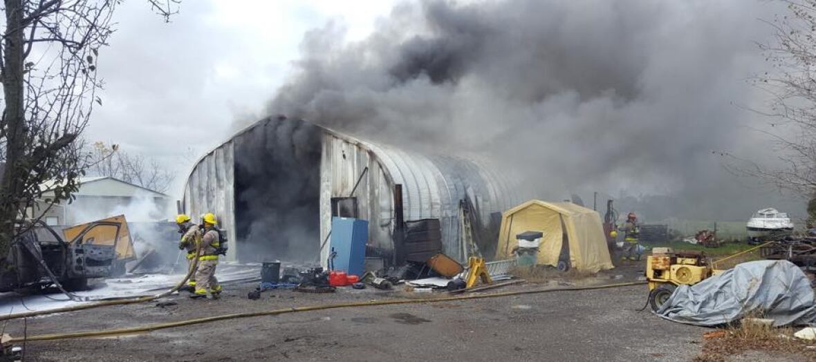 Fire crews spend afternoon fighting 'stubborn' structure fire in