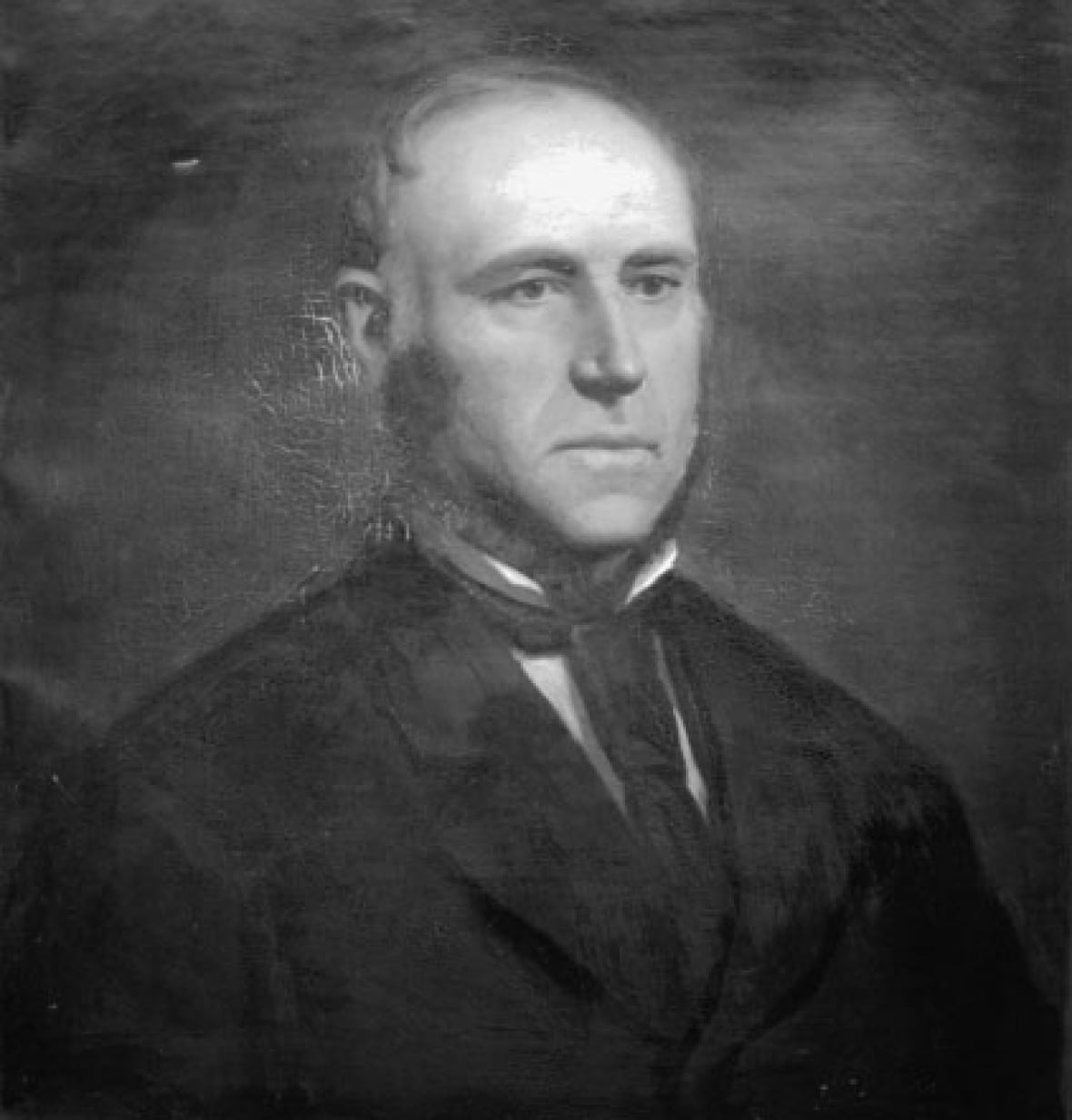 A historical black and white photo of a man in the mid-1800s.