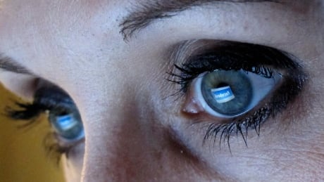 An illustration picture shows a woman looking at the Facebook website on a computer in Munich February 2, 2012. Facebook unveiled plans for the biggest ever Internet IPO that could raise as much as $10 billion, but made it clear CEO Mark Zuckerberg will exercise almost complete control over the company, leaving investors with little say. REUTERS/Michael Dalder (GERMANY - Tags: BUSINESS SCIENCE TECHNOLOGY) - BM2E82211U501 FACEBOOK/