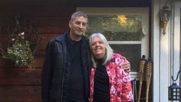 Bob and Joyce Taylor are shown outside their home. They say a fraudster used a supplementary credit card they didn't sign up for and spent $6,200. 