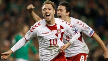 Denmark's Christian Eriksen celebrates after scoring his side's third goal during the World Cup qualifying second-leg soccer match between Ireland and Denmark on Tuesday. ireland-denmark
