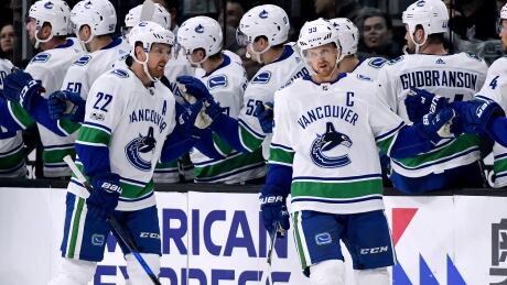 Henrik Sedin, right, put up a goal and an assist in the Vancouver Canucks' 3-2 win over the Los Angeles Kings on Tuesday. Henrik Sedin