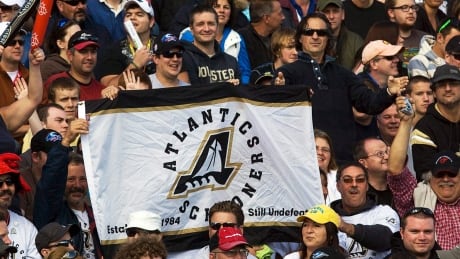 Fans display an Atlantic Schooners banner at the Toronto-Edmonton game at Moncton Stadium in Moncton, N.B., on Sept. 26, 2010. The team was to join the CFL in the 1980s but never played a game because funding could not be secured for a stadium. schooners