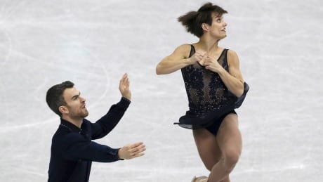 Meagan Duhamel and Eric Radford of Canada perform at the ISU Grand Prix of Figure Skating Final in Nagoya, Japan, on Thursday. The pair finished fifth in the short program. Japan Figure Skating Grand Prix Final