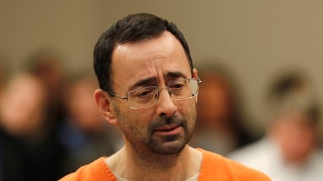 Dr. Larry Nassar, seen in court last month, was sentenced to 60 years on child porn charges by a federal judge in Grand Rapids, Mich., on Thursday. nassar-larry-12217-620