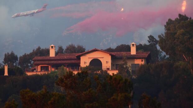 Firefighters look to gain on California wildfire as winds ...