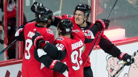 Ottawa Senators right wing Mark Stone (61) and centre Matt Duchene (95) congratulate teammate Bobby Ryan on his goal in the first period against the Rangers. rangers-senators