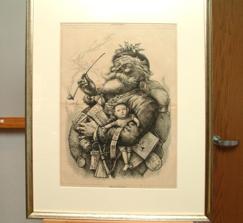 A framed drawing of Santa Claus.