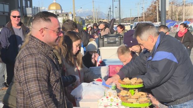 Volunteers prepare high tea for homeless people living on 135A street in Surrey.