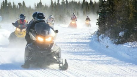 The three men were snowmobiling on Mount Gosford when they got lost and had to spend the night outside. snowmobile