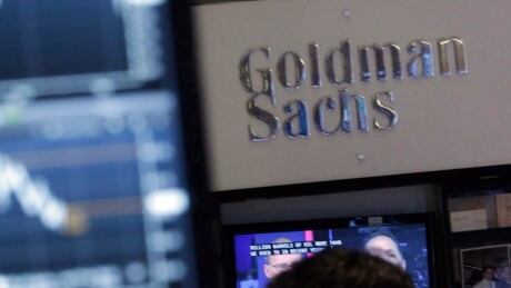 In this Oct. 16, 2014, record photo, a surface astatine a trading station connected the level of the New York Stock Exchange is juxtaposed with the Goldman Sachs booth. Financeit Goldman Investment 20171214