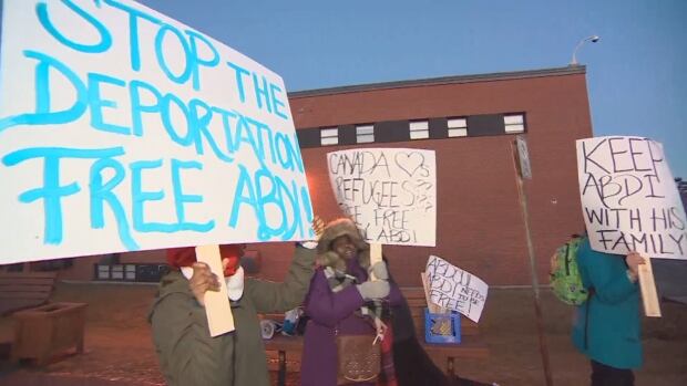 Supporters of Abdi demonstrated in Lower Sackville, N.S., on Tuesday, where Prime Minister Justin Trudeau was holding a town hall meeting.