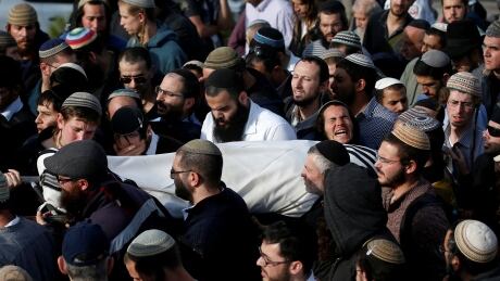 Relatives and friends carry the body of Israeli Rabbi Raziel Shevach during his funeral in the Havat Gilad settlement outpost in West Bank. ISRAEL-PALESTINIANS/FUNERAL