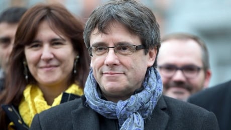 Ousted Catalan leader Carles Puigdemont, centre, is shown with elected Catalan lawmakers of his Together for Catalonia party at a park in Brussels on Friday. Several questions remain about the leadership of the region and its future relationship to Madrid after the December vote. Belgium Spain Catalonia
