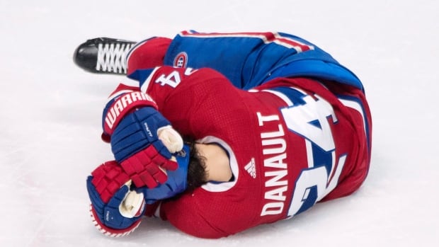 Canadiens' Danault taken off ice on stretcher after taking Chara shot to head | CBC Sports