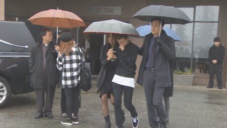 Mourners leave the Coquitlam Alliance Church Saturday following the funeral service for 15-year-old Alfred Wong, killed by a stray bullet when his family's vehicle was caught in crossfire in a gang-related shooting on Jan. 13. Wong funeral