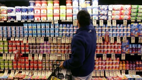 **FILE** A man shops in the yogurt aisle at a Safeway store in San Francisco in this July 18, 2006 file photo. Grocery store chain Safeway Inc. said Thursday its fourth-quarter profit climbed 78 percent on higher revenue and a tax gain. (AP Photo/Jeff Chiu, file) EARNS SAFEWAY