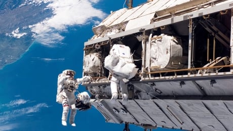 FILE - In this Dec. 12, 2006, file photo, made available by NASA, astronaut Robert L. Curbeam Jr., left, and European Space Agency astronaut Christer Fuglesang, participate in a space walk during construction of the International Space Station. Under President Donald Trump’s 2019 proposed budget released, Monday, Feb. 12, 2018, U.S. government funding for the space station would cease by 2025. The government would set aside $150 million to encourage commercial development. Trump-Budget-NASA