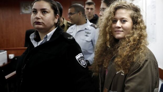 Father of Palestinian teen said to have slapped Israeli soldier is pessimistic as trial begins | CBC News