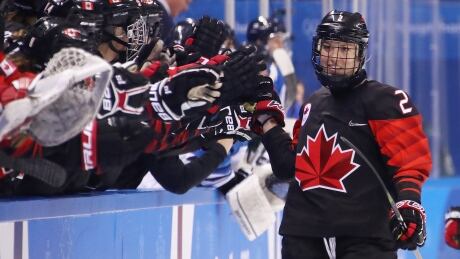 Meghan Agosta, right, is one of four Canadian players with four points in three games played. meghan-agosta