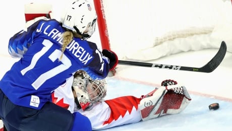 Jocelyne Lamoureux-Davidson, left, scored the golden goal on Canadian netminder Shannon Szabados in a shootout. US Wins Women's Hockey Gold Canada