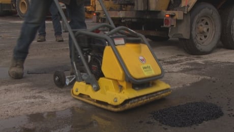 City of Ottawa crews patch potholes in February 2018. ottawa pothole patch fill fix