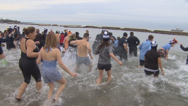 Balmier-than-usual polar plunge raises $50000 for Special Olympics Balmier-than-usual polar plunge raises $50000 for Special Olympics