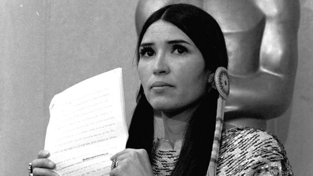 Sacheen Littlefeather receives apology at Academy event 49 years after Marlon Brando's Oscars protest; In this March 27, 1973, file photo, Sacheen Littlefeather, tells the audience at the Academy Awards ceremony that Marlon Brando was declining to accept his Oscar as best actor for his role in The Godfather. The move was meant to protest Hollywood's treatment of American Indians. 