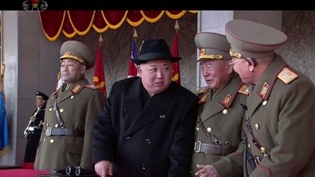In this image made from video by North Korea's KRT, North Korean leader Kim Jong-un, centre, speaks with military officials during a military parade in Pyongyang on Feb. 8. UN experts, among other accusations, say a North Korean delegation transferred to Syria in 2016 special resistance valves and thermometers known for use in chemical weapons programs. North Korea Military Parade/Kim Jong Un