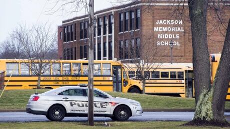 A police car is parked outside Jackson Township Middle School on Feb. 20 in Massillon, Ohio. A police official said the boy had the opportunity to shoot other students, according to video evidence, but that they're grateful he changed his mind. Student Shoots Self School