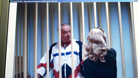 ** FILE ** In this Wednesday, Aug. 9, 2006 file picture Sergei Skripal speaks to his lawyer from behind bars seen on a screen of a monitor outside a courtroom in Moscow.Russian President Dmitry Medvedev has signed a decree pardoning four convicted foreign spies so they can be exchanged for 10 people accused of spying for Russia in the United States, the Kremlin said Friday, July 9, 2010, Sergei Skripal is one of them. Russia US Spy Swap Candidates Glance