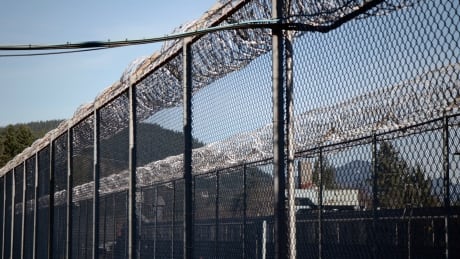 Barbed wire lines the fences surrounding the Mission Medium Security Institution in British Columbia. jail prison Correctional Service barbed wire fence