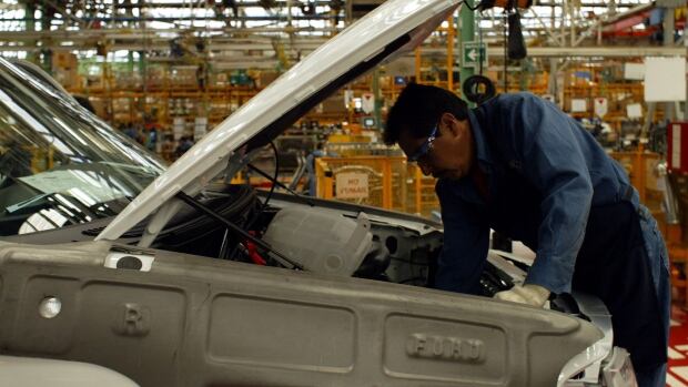 A worker assembles a Ford F-150 pickup trucks at a plant in Cuautitlan, Mexico. Reports this week suggest U.S. NAFTA negotiators have made a key concession on the amount of American-made components that must be included in cars built in Canada and Mexico bound for the U.S. market.