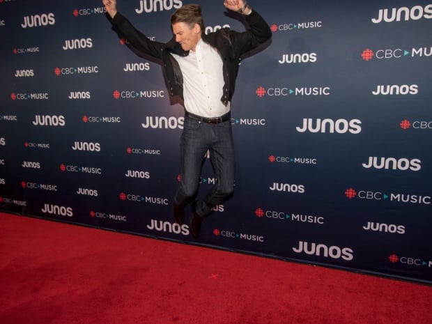 Vancouver Mayor Gregor Robertson shows off his inner rockstar on the red carpet during arrivals for