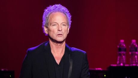 FILE - In this Oct. 6, 2014 file photo, Lindsey Buckingham from the band Fleetwood Mac performs at Madison Square Garden in New York. The band said in a statement Monday that Buckingham is out of the band for its upcoming tour. Buckingham left the group once before, from 1987 to 1996. He’ll be jointly replaced by Neil Finn of Crowded House and Mike Campbell of Tom Petty and the Heartbreakers. (Photo by Charles Sykes/Invision/AP, FIle) Music-Fleetwood Mac