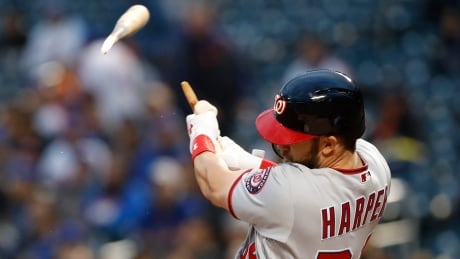 Washington Nationals' Bryce Harper hits a solo home run against the New York Mets on Monday despite breaking his bat on the swing. harper-bryce