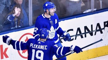 Toronto centre Tomas Plekanec celebrates one of linemate Patrick Marleau's two goals in the Leafs' 4-2 win over Boston on Monday. HKN Bruins Maple Leafs 20180416